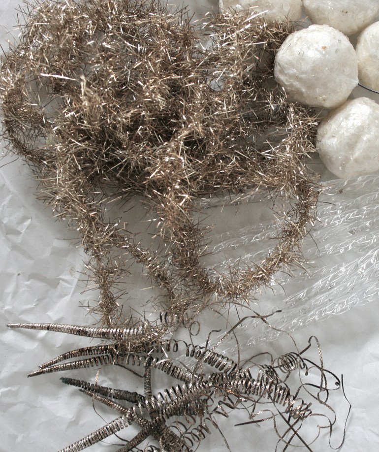 Vintage tinsel garland, handmade snowball ornaments, glass and tarnished icicles.