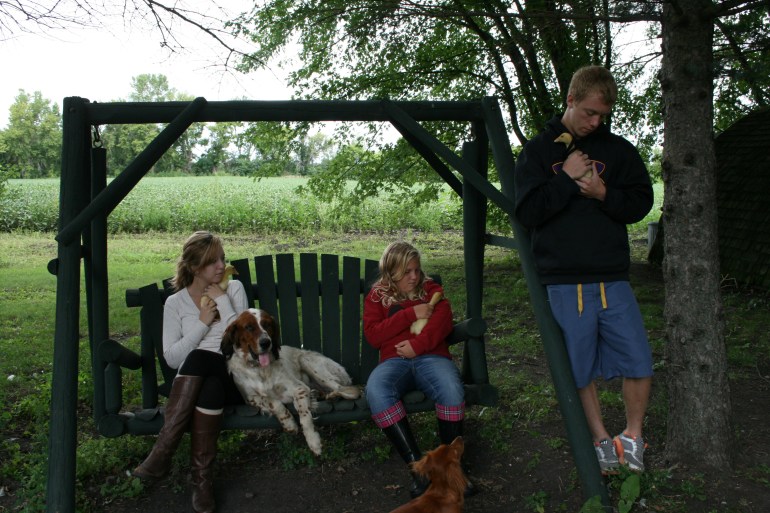 My kids snuggling the ducklings!  