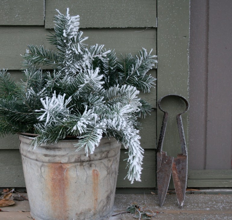 A vintage garden shear rests on the porch of Rabbit Run Cottage. 