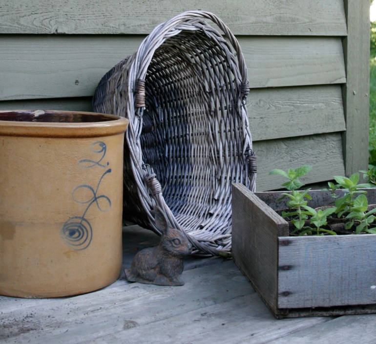 Baskets, crocks and old crates make nice garden containers.